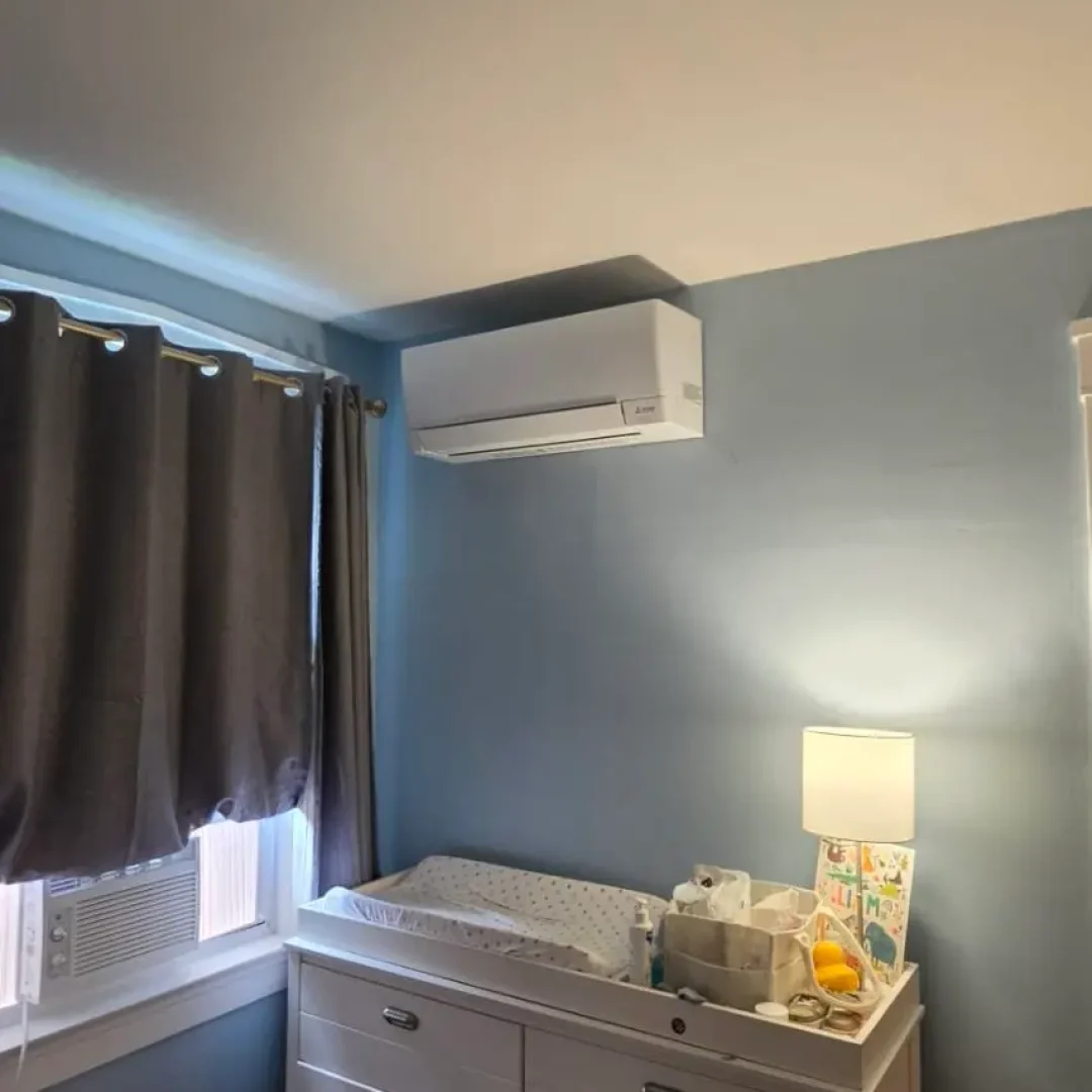 Mitsubishi ductless indoor head installed in a family living space in Lowell MA