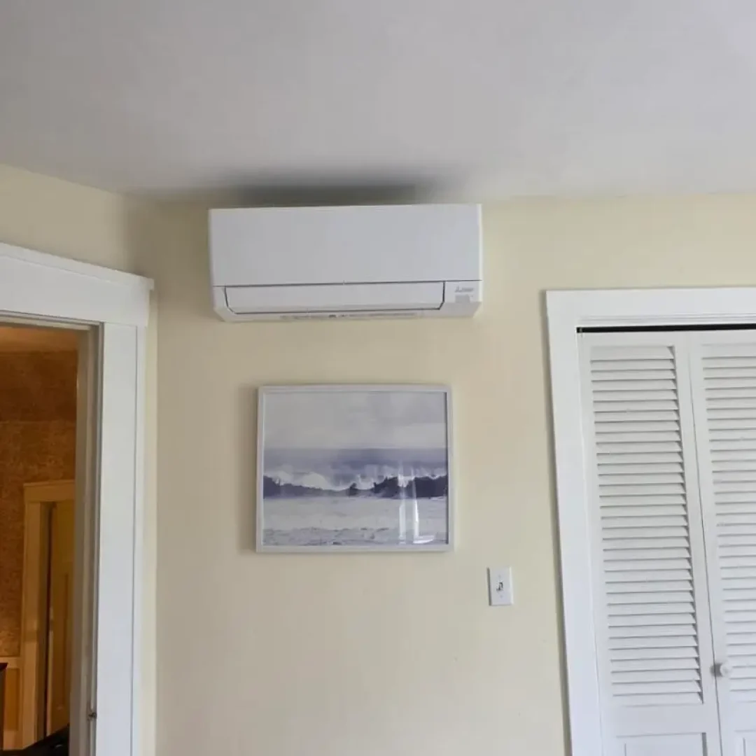 Mitsubishi wall-mounted mini split head installed in a bedroom of a Lowell MA home