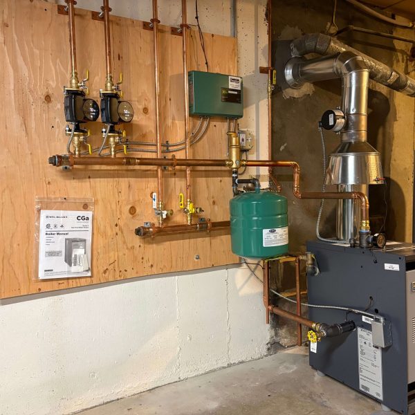 Weil-McLain gas boiler with new near-boiler piping installed in a Bedford, MA home